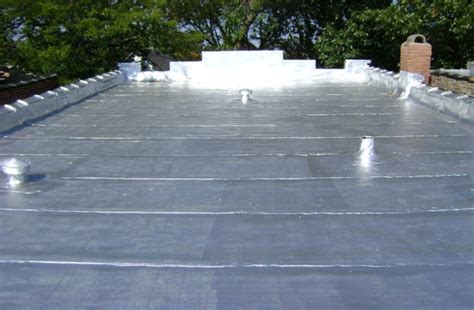 house with silver metal roof|silver coating for flat roofs.